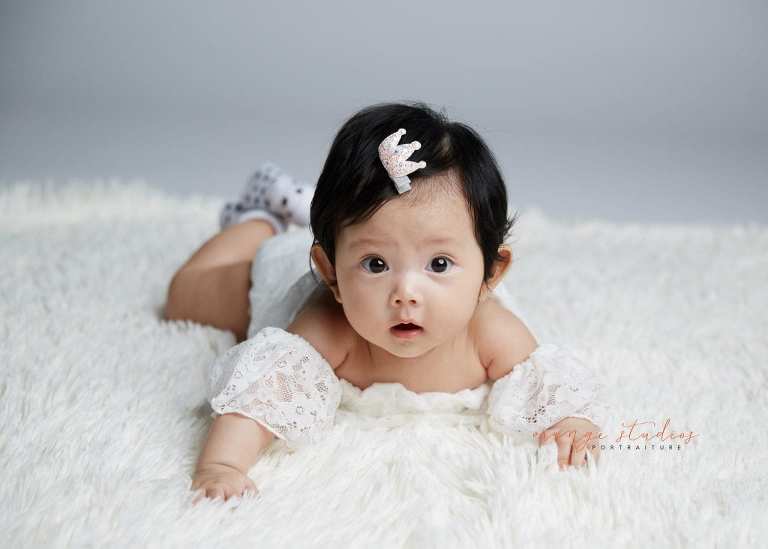 cute baby girl tummy down portraits in singapore studio