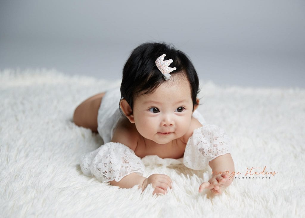 baby girl tummy down portraits in singapore studio