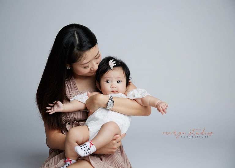 mum and baby girl family portraits in singapore studio
