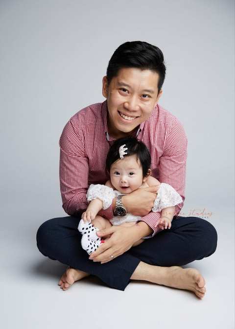 dad and cute baby girl family portraits in singapore studio