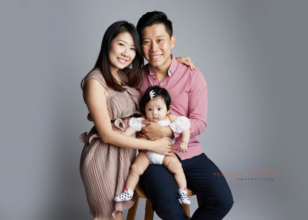 cute baby girl and parents family portraits in singapore studio