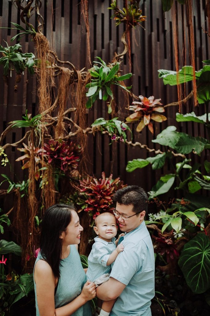 1 year old baby boy with parents in outdoor family portraits