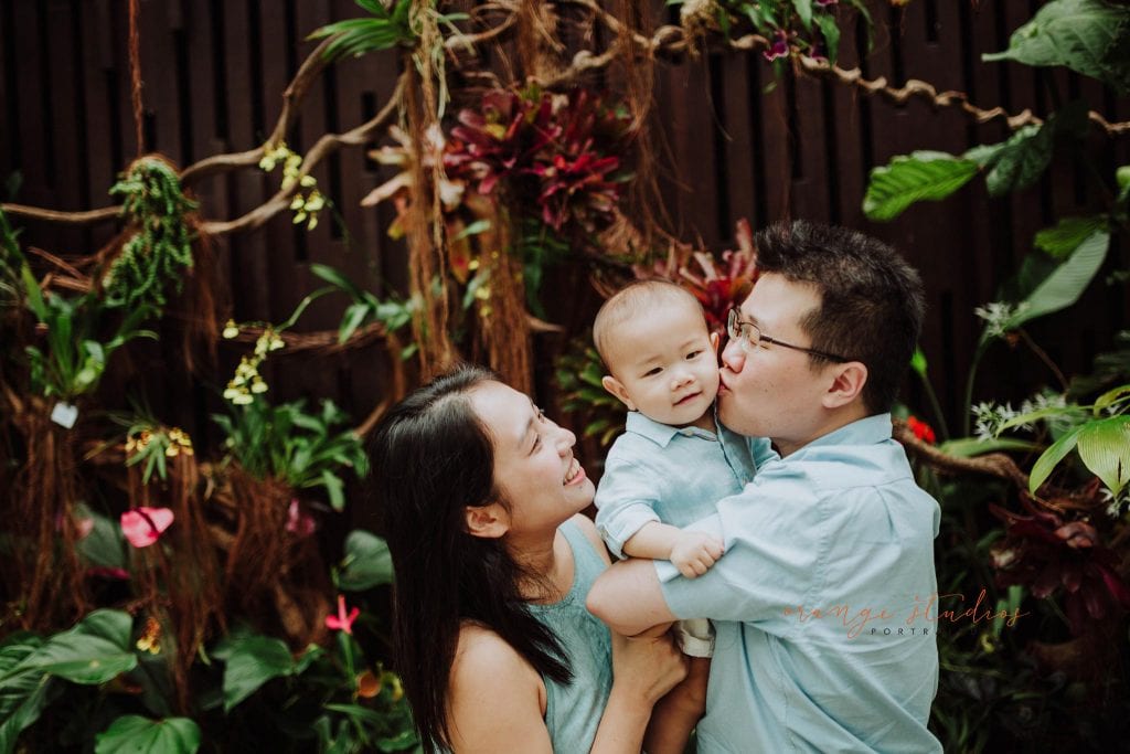 1 year old baby boy with parents in outdoor family portraits