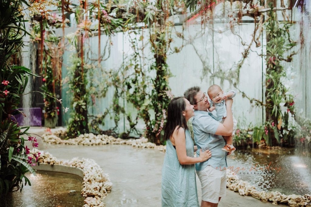 1 year old baby boy with parents in outdoor family portraits