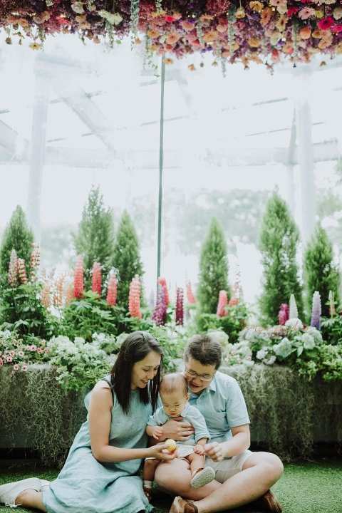 1 year old baby boy with parents in outdoor family portraits