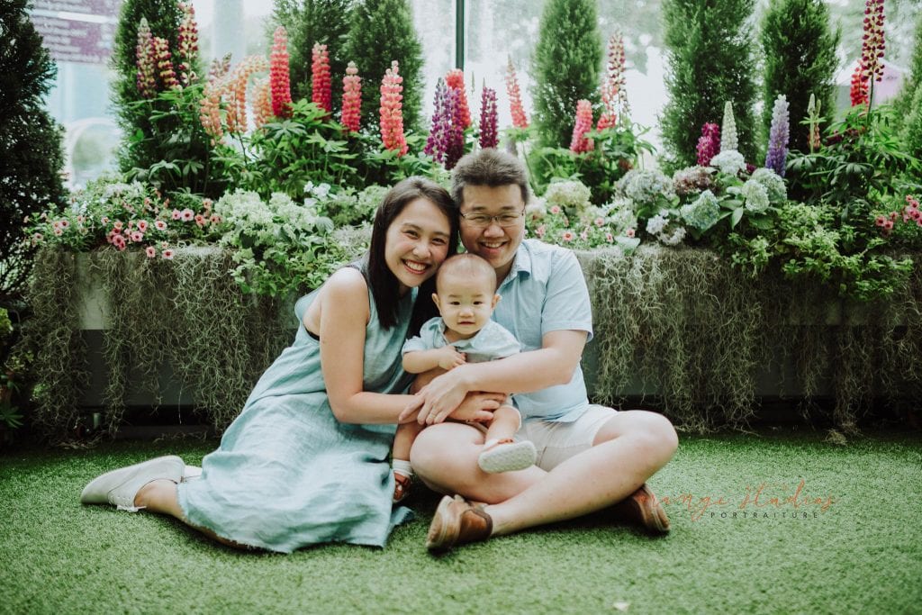 1 year old baby boy with parents in outdoor family portraits