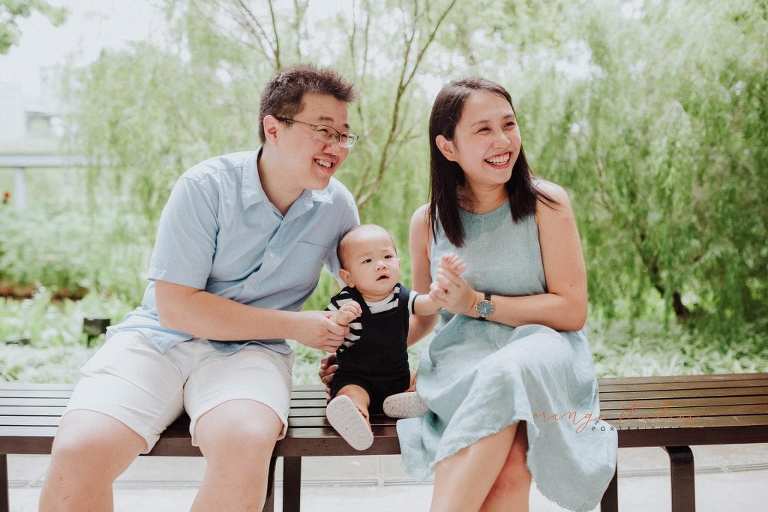 1 year old baby boy with parents in outdoor family portraits