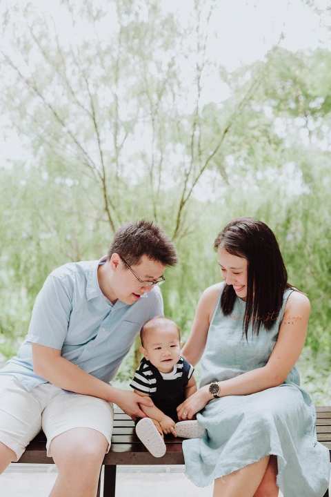 1 year old baby boy with parents in outdoor family portraits