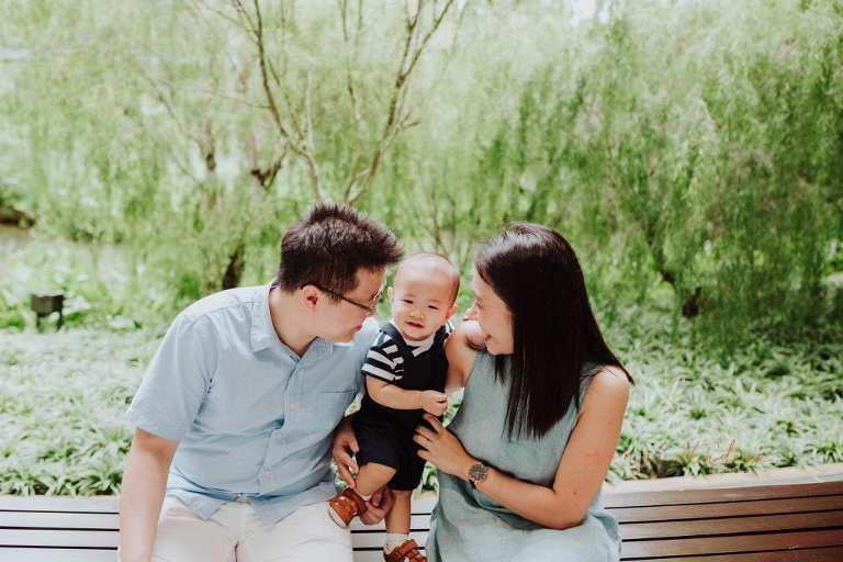 1 year old baby boy with parents in outdoor family portraits