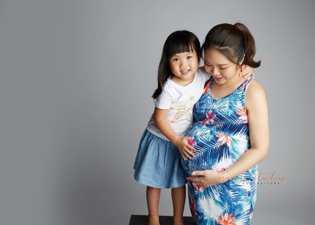 mum and girl maternity portraits in singapore studio