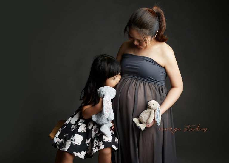 mum and girl maternity portraits in singapore studio