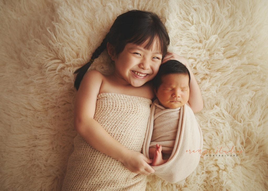8 days old baby boy newborn portraits with elder sister in singapore studio