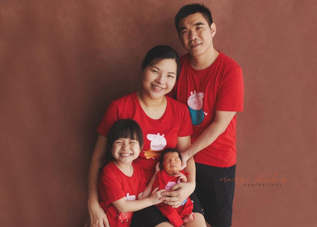 8 days old baby boy with family newborn portraits in singapore studio