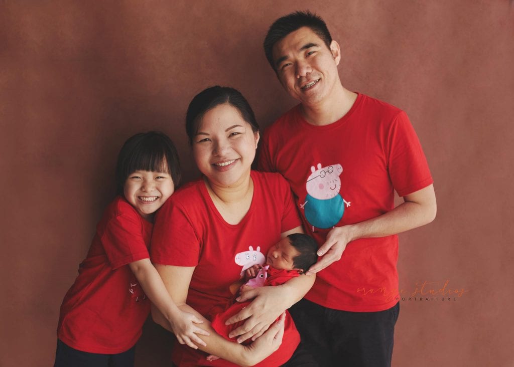 8 days old baby boy with family newborn portraits in singapore studio