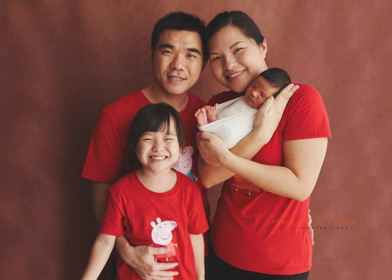 8 days old baby boy with family newborn portraits in singapore studio
