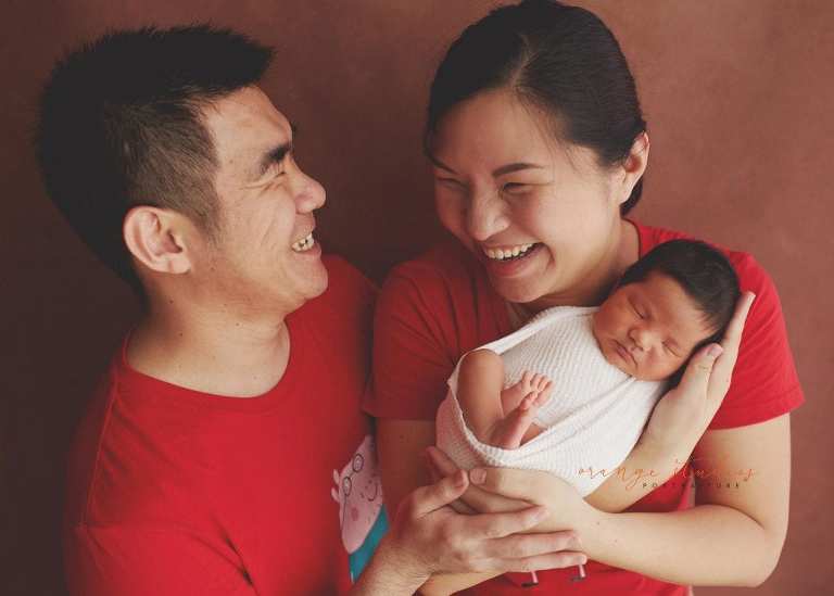 8 days old baby boy with parents newborn portraits in singapore studio