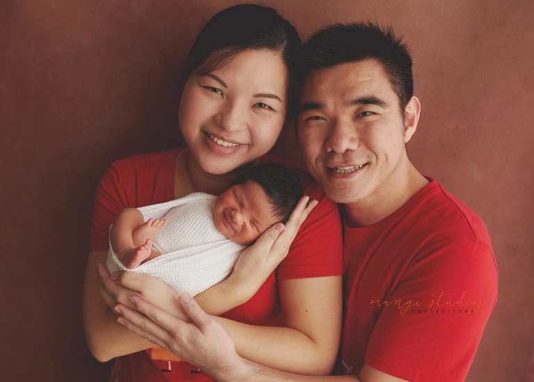 8 days old baby boy with parents newborn portraits in singapore studio