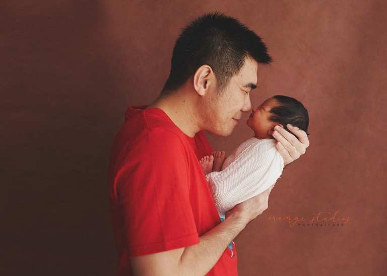 8 days old baby boy with dad newborn portraits in singapore studio