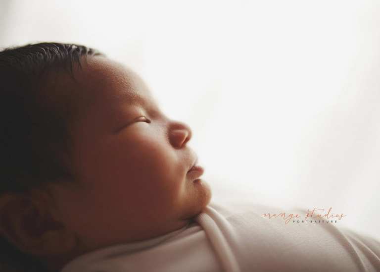 8 days old baby boy side profile newborn portraits in singapore studio