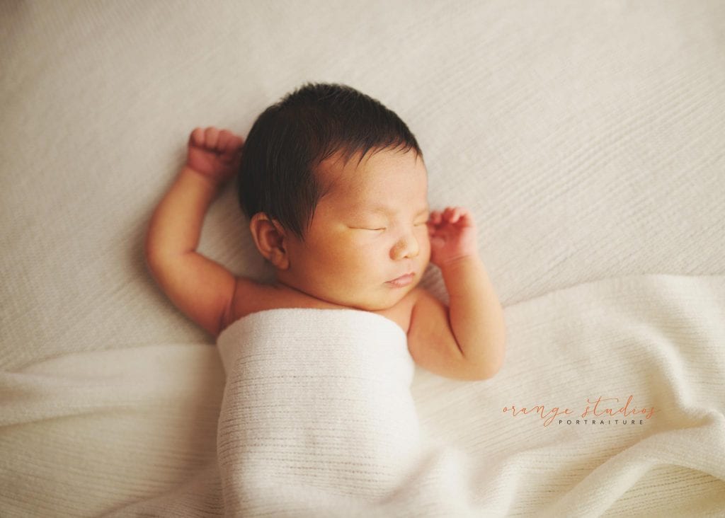 8 days old baby boy relaxing newborn portraits in singapore studio