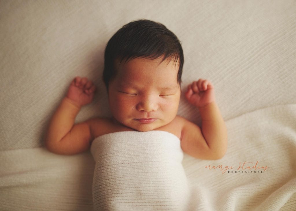 8 days old baby boy relaxing newborn portraits in singapore studio