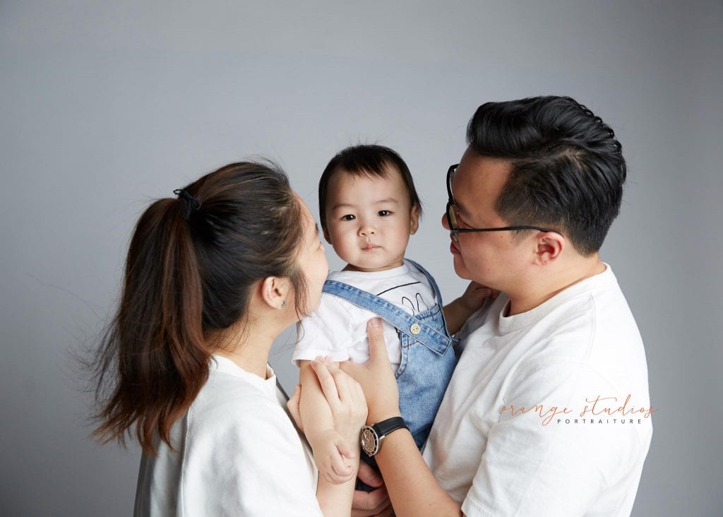 1 year old baby with parents family portraits in singapore studio