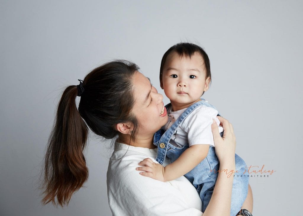 1 year old baby with mum family portraits in singapore studio