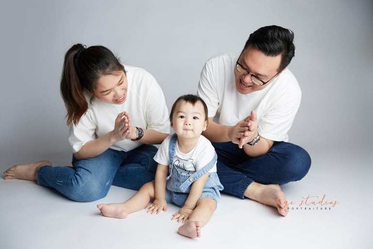 1 year old baby with parents family portraits in singapore studio