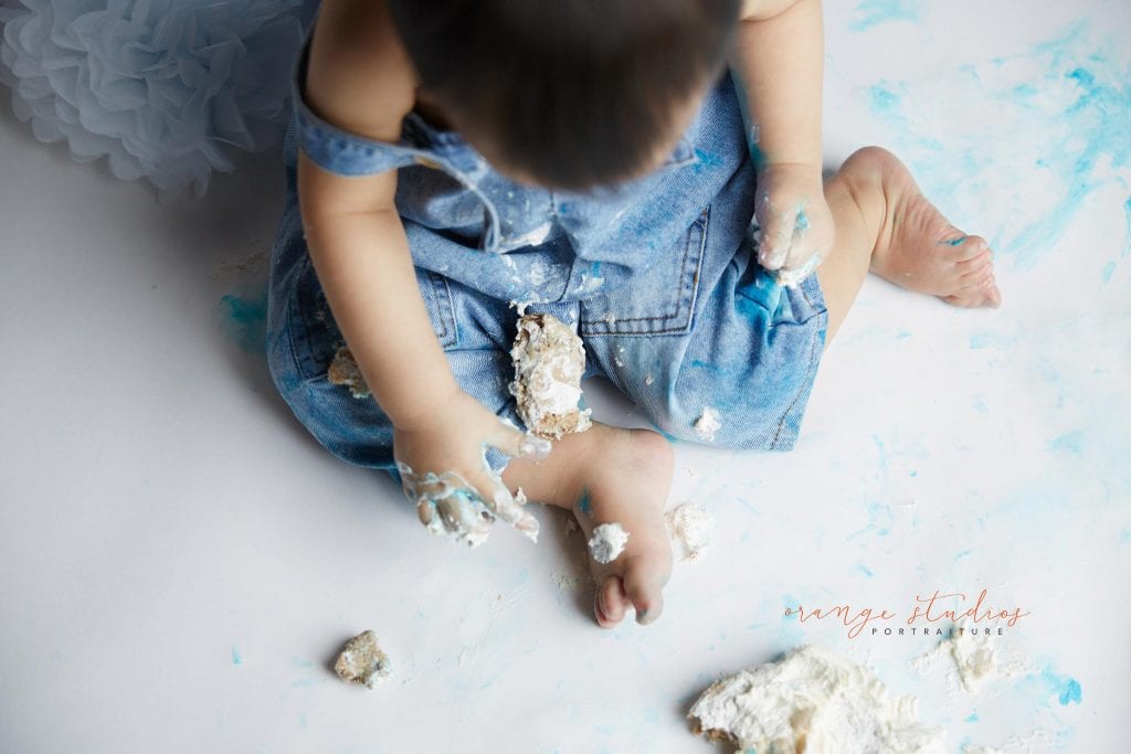 1 year old baby boy blue and grey theme cake smash portraits in singapore studio