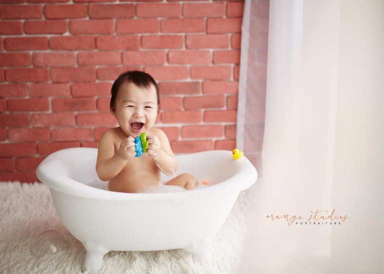 1 year old baby boy bubble bath portraits in singapore studio natural light