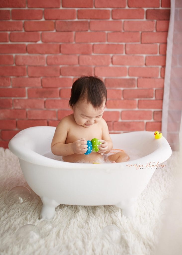 1 year old baby boy bubble bath portraits in singapore studio natural light