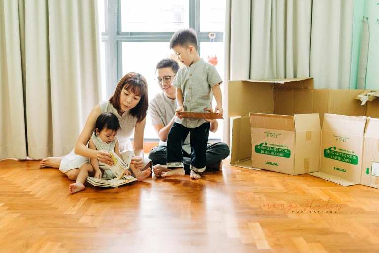 parents playing with kids family portraits at home in singapore