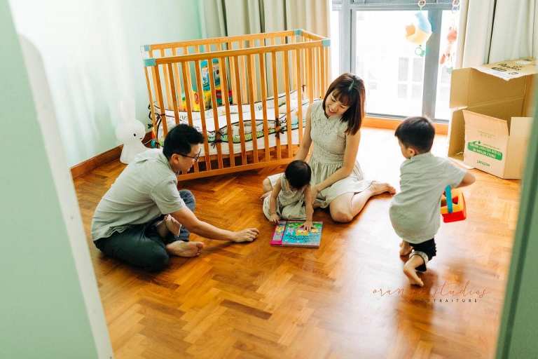 parents playing with kids family portraits at home in singapore