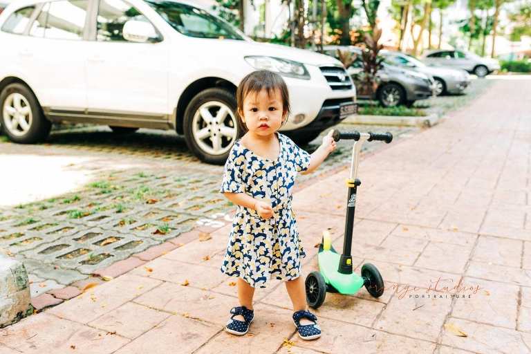 little girl with scooter outdoor portraits in singapore