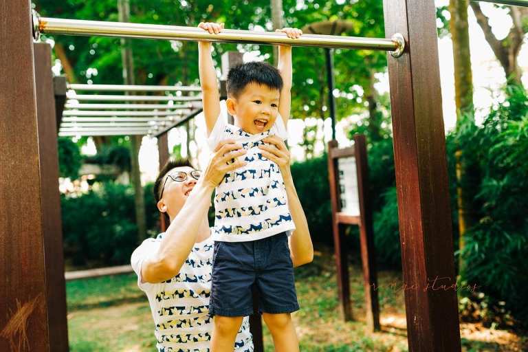 dad and son playing outdoor family portraits in singapore