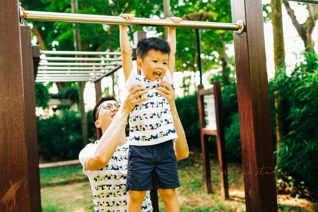 dad and son playing outdoor family portraits in singapore
