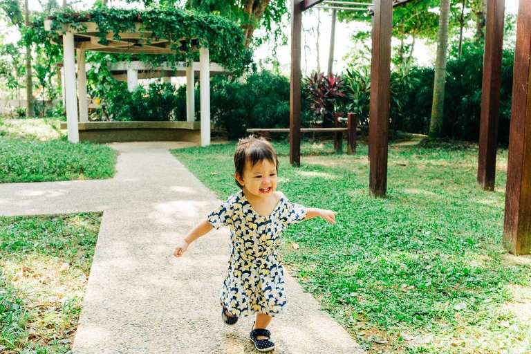 little girl running outdoor portraits in singapore