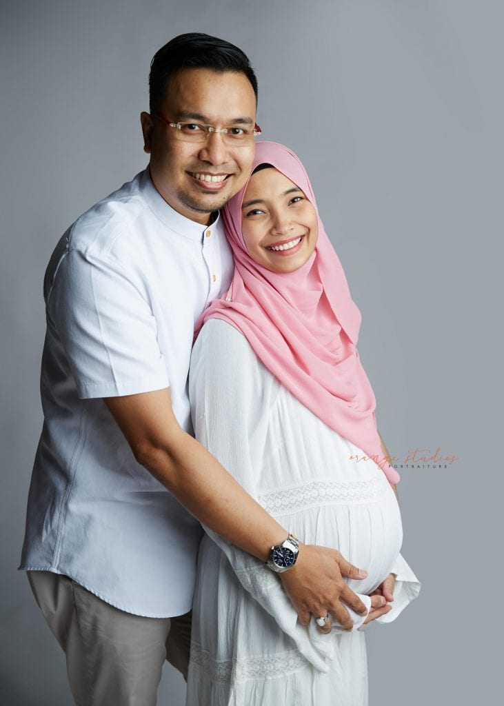 malay muslim couple maternity portraits in singapore studio