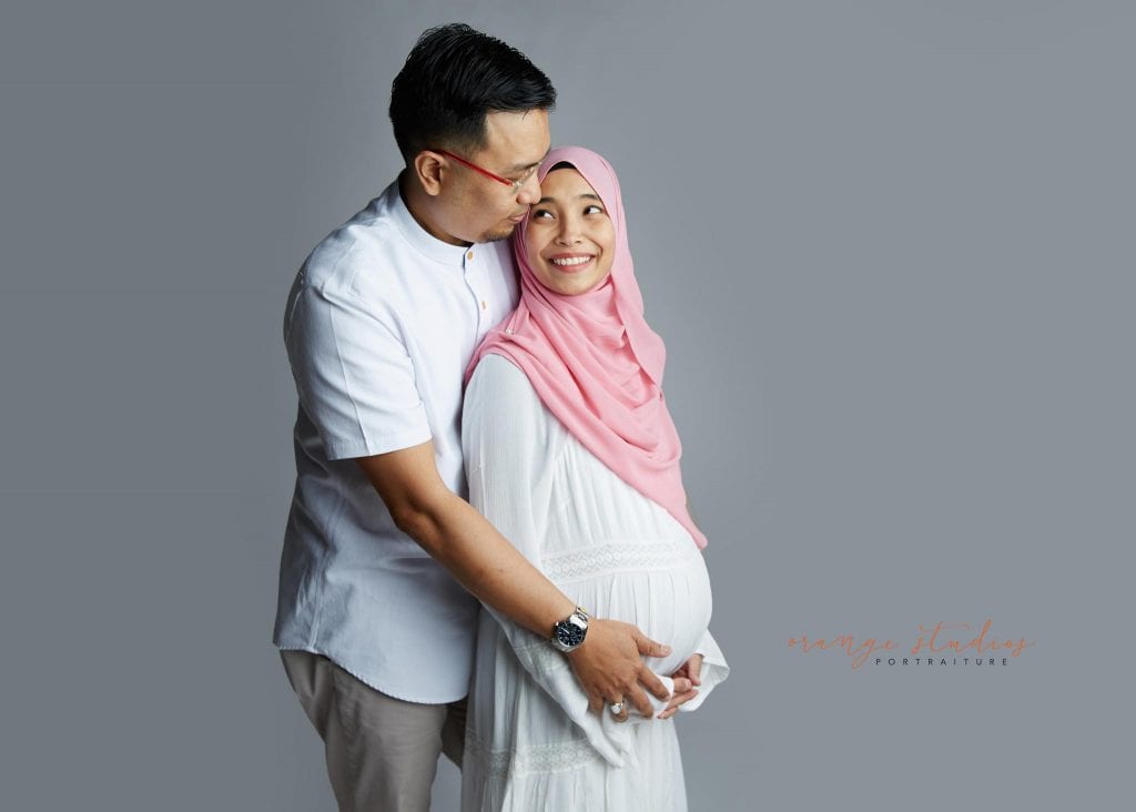 malay muslim couple maternity portraits in singapore studio