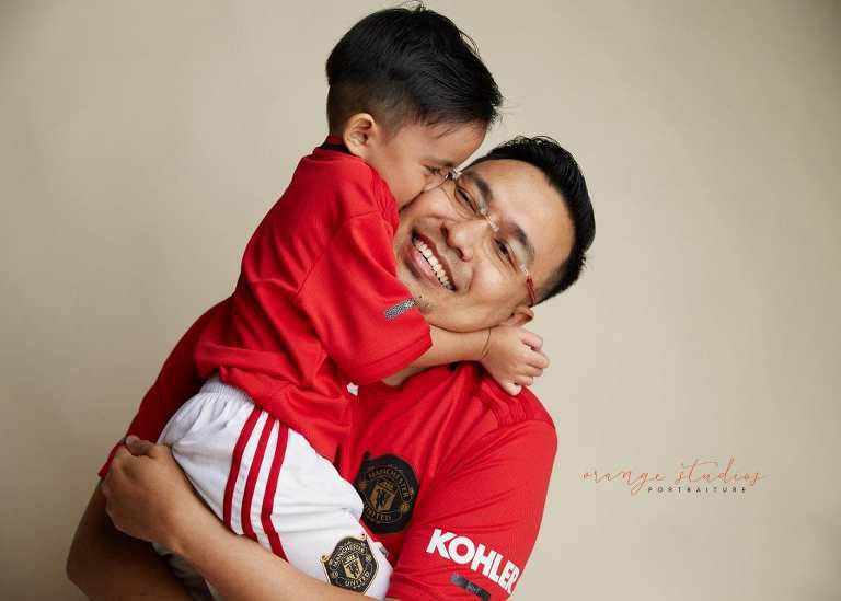 sweet family portrait of dad and son in singapore studio