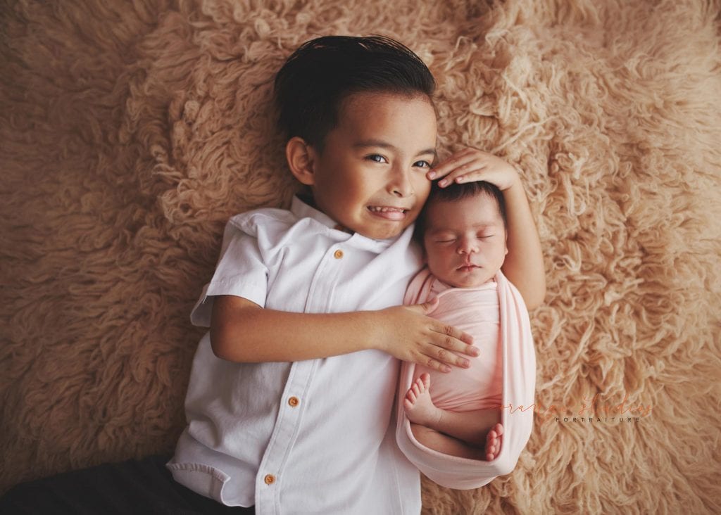 7 days old baby girl newborn portraits with elder brother in singapore studio