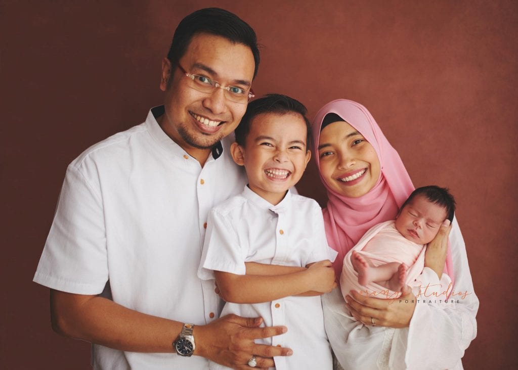 7 days old baby girl with family newborn portraits in singapore studio