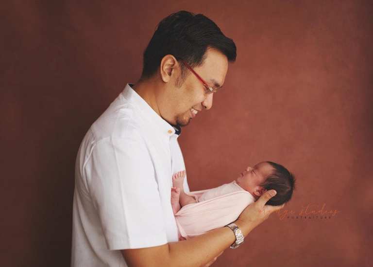7 days old baby girl newborn portraits with dad in singapore studio