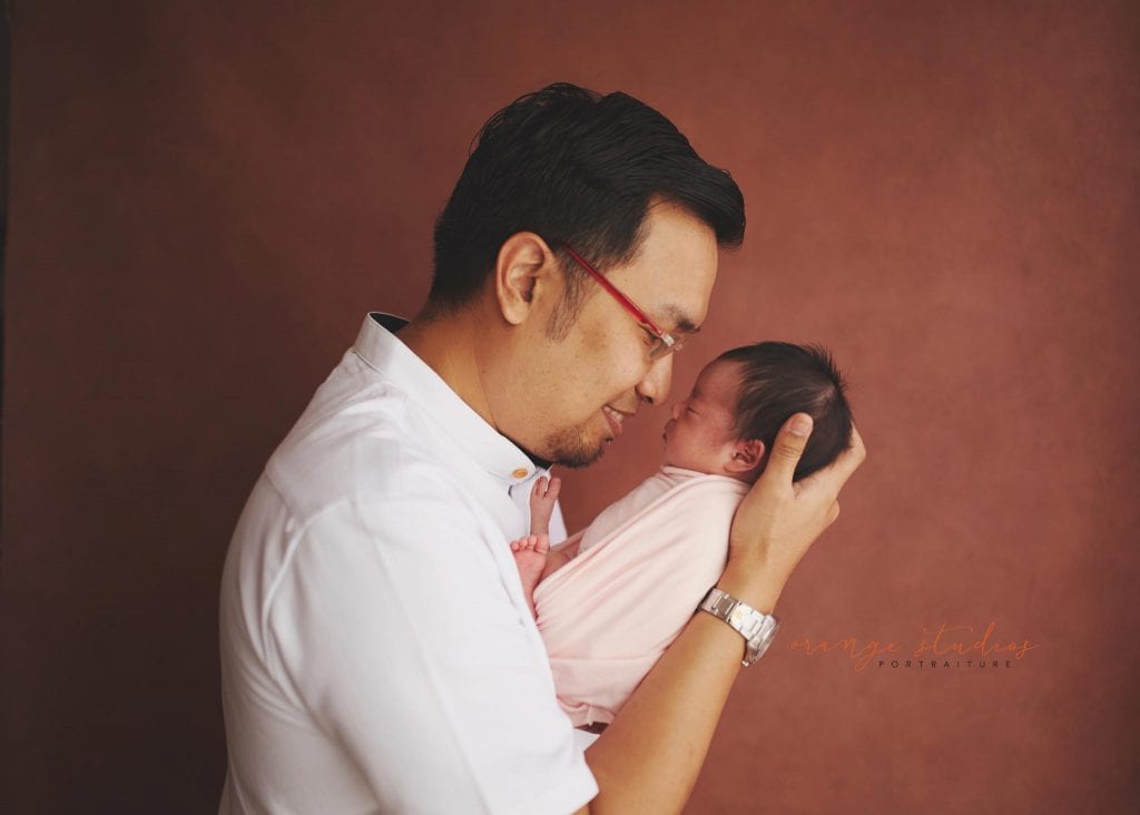 7 days old baby girl newborn portraits with dad in singapore studio