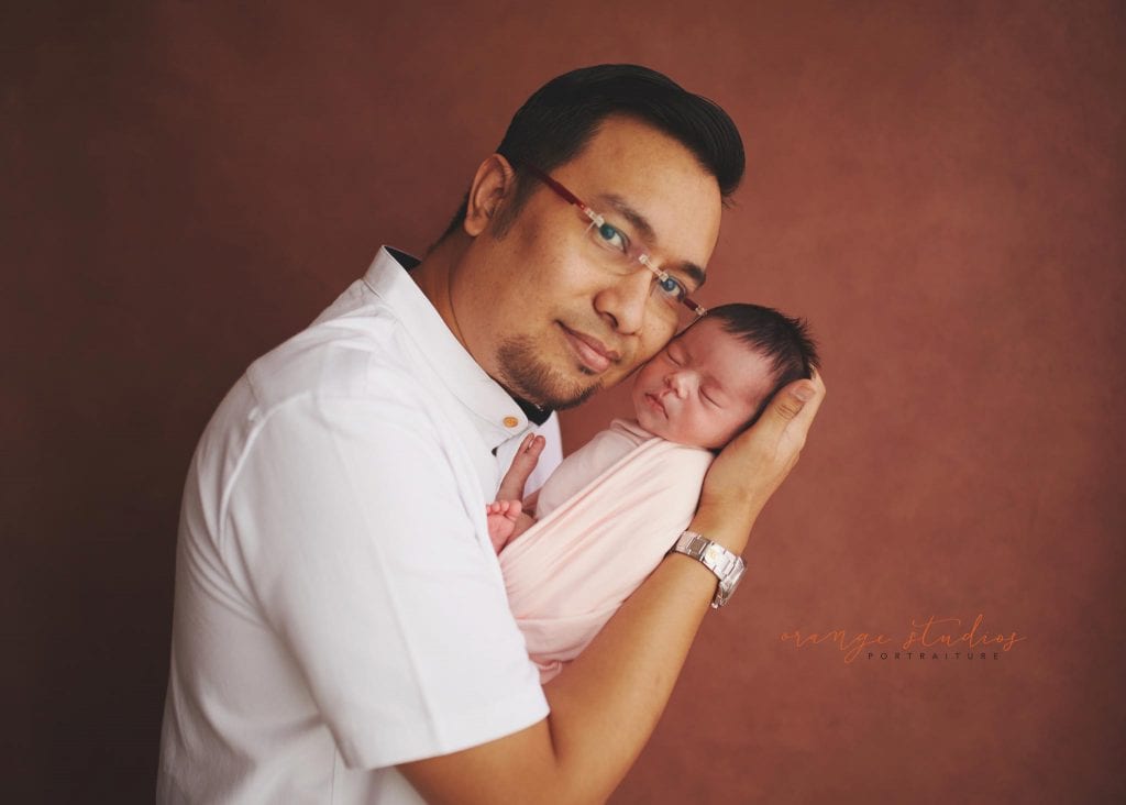 7 days old baby girl newborn portraits with dad in singapore studio
