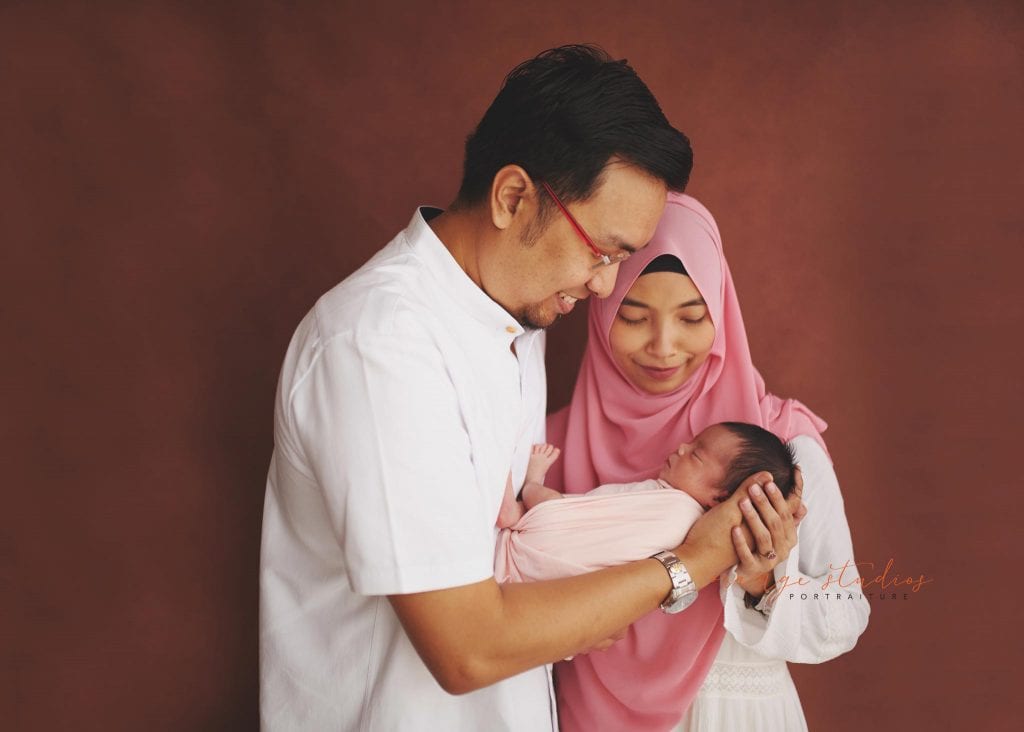 7 days old baby girl newborn portraits with parents in singapore studio