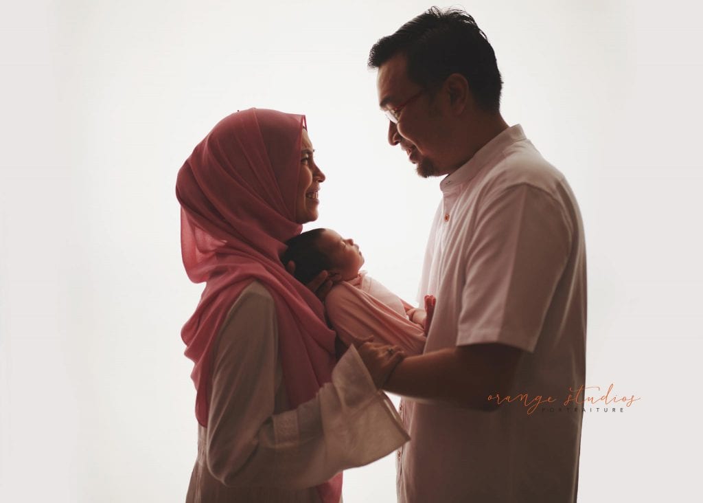 7 days old baby girl newborn portraits with parents in singapore studio