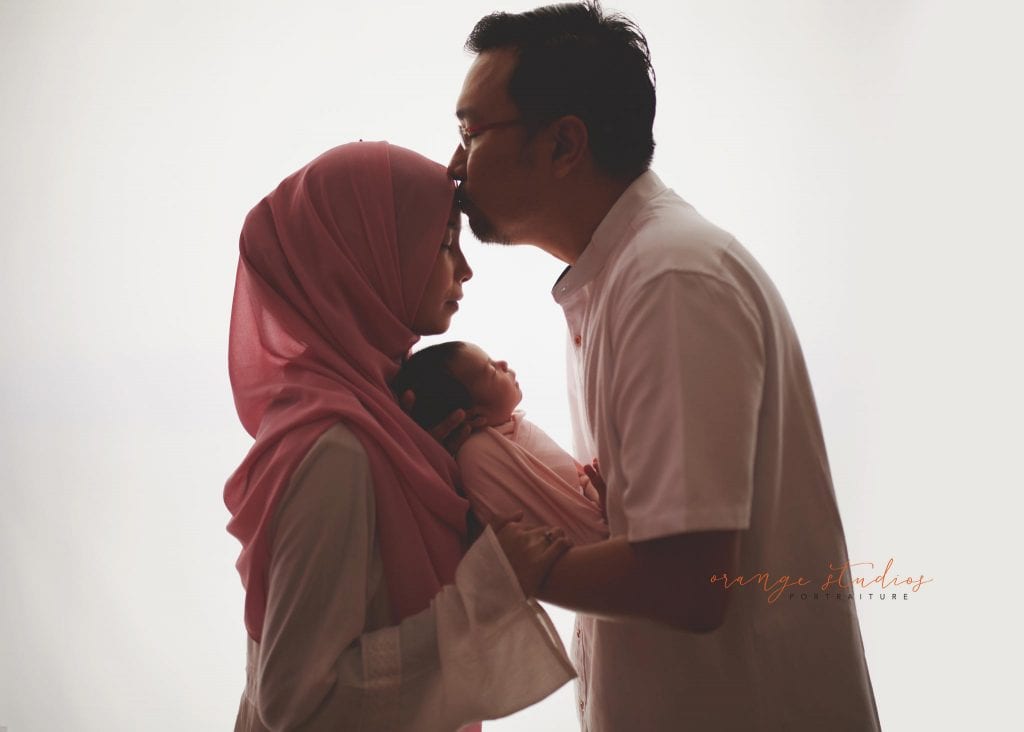 7 days old baby girl newborn portraits with parents in singapore studio