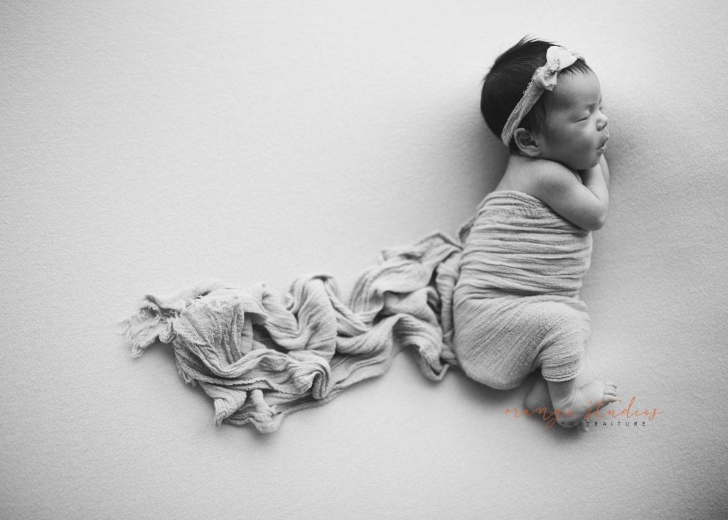 7 days old baby girl black and white newborn portraits in singapore studio