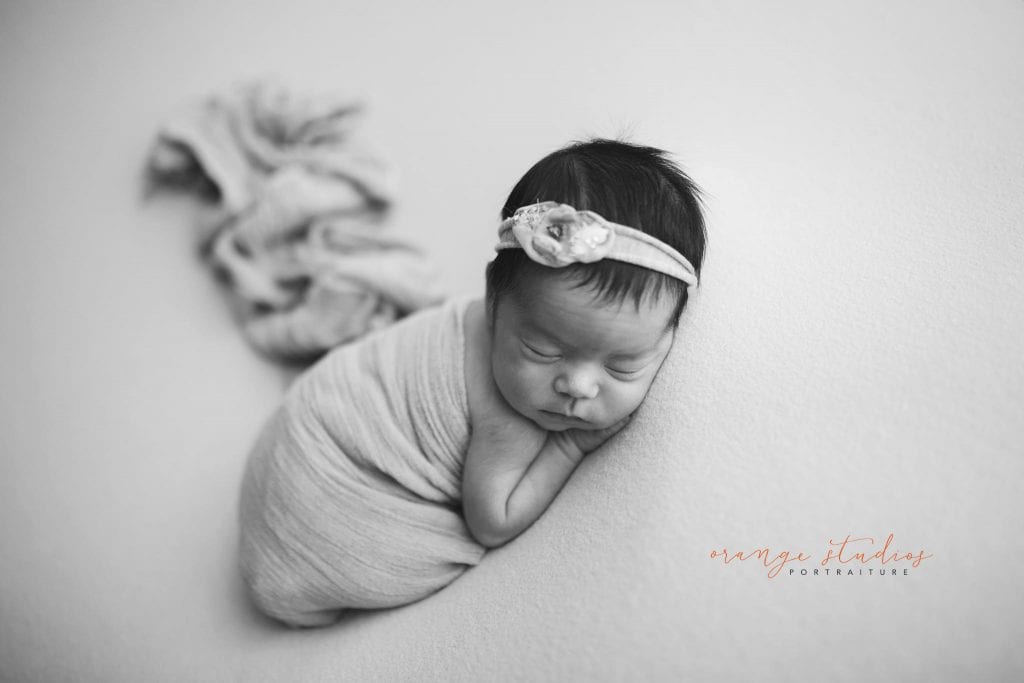 7 days old baby girl black and white newborn portraits in singapore studio